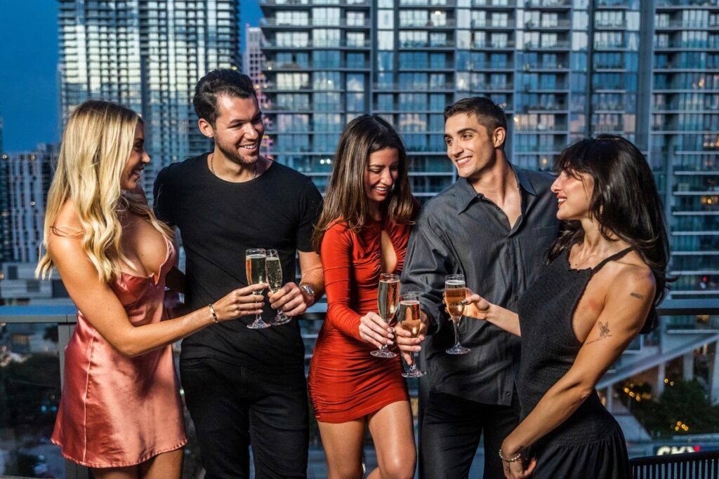 group of friends enjoying drinks on rooftop