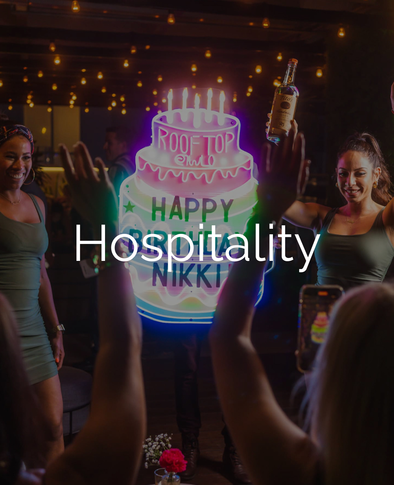 "hospitality" text over image of happy birthday cake